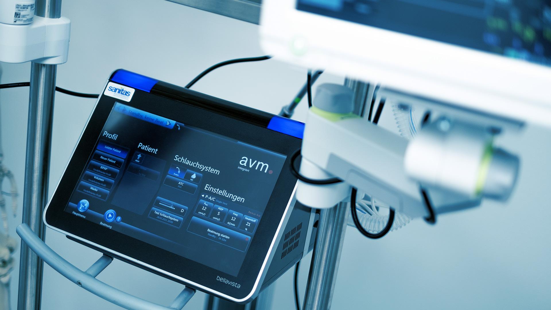 Photo of a bellavista patient ventilator and a patient monitor in the upper right corner