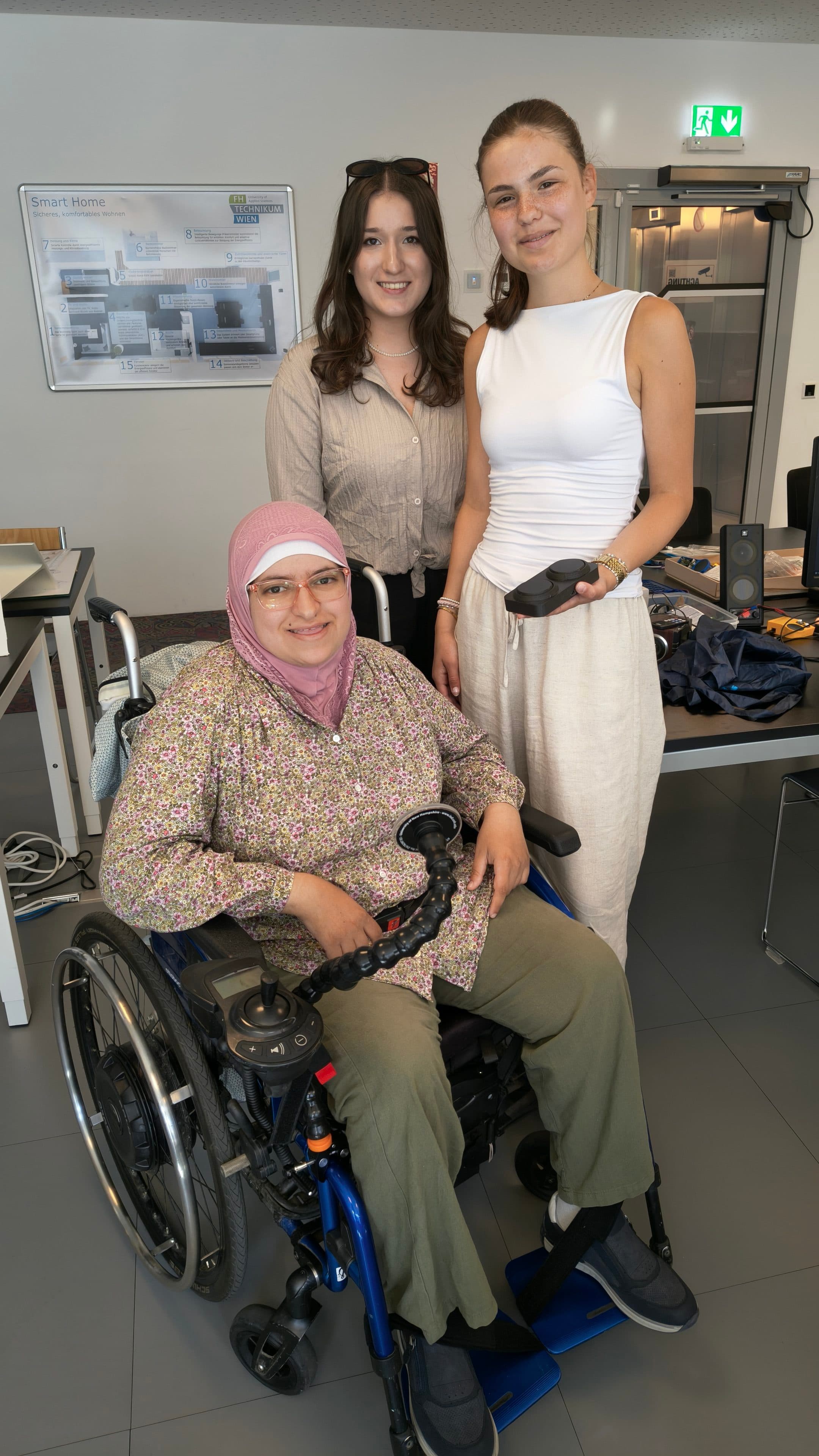 Group picture of team sea girls together with Marua, showing the smartphone holder and the bluetooth-based remote keyboard.